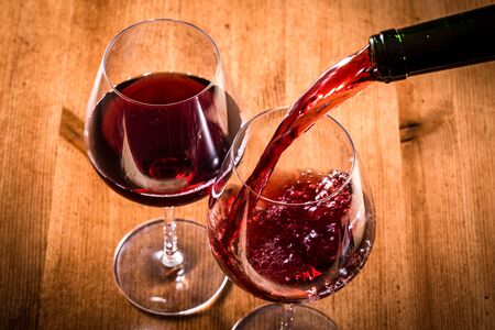 Pour the red wineの写真素材
