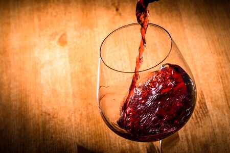 Pour the red wineの写真素材