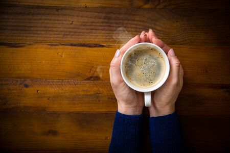 Woman with hot coffeeの写真素材