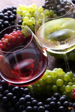 Two glasses of wine and grapesの写真素材