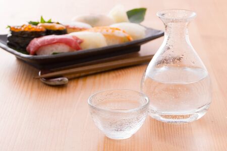 Cold sake and sushiの写真素材