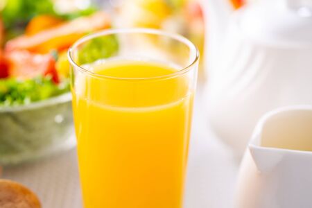 drink orange juice for breakfastの写真素材