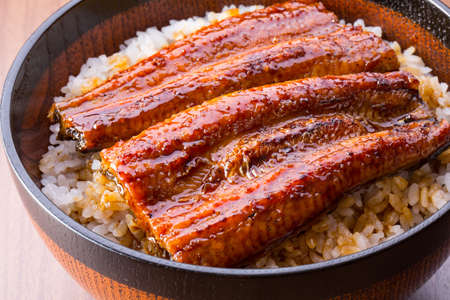 Eating Japanese food, eel bowlの写真素材