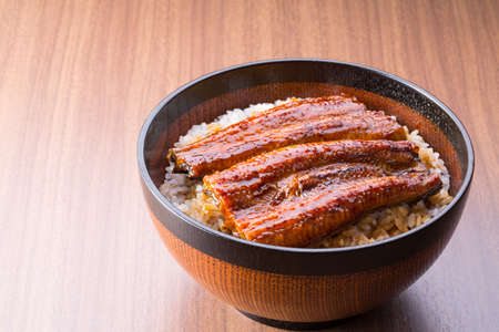 Eating Japanese food, eel bowlの写真素材