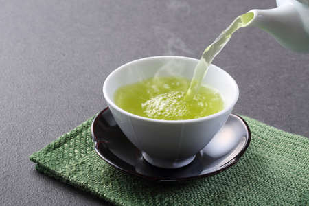 Pour Japanese green teaの写真素材