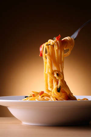 Pasta with tomatoes and vegetablesの写真素材