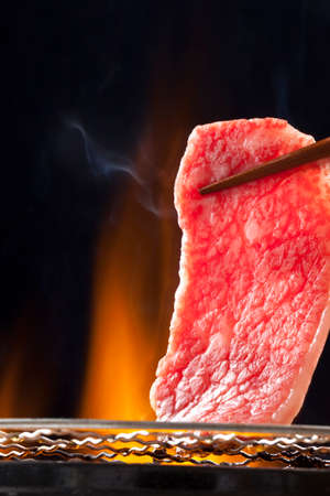 grill meat at a yakiniku restaurantの写真素材