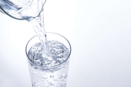 pour water into a glass