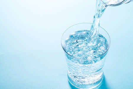 pour water into a glass
