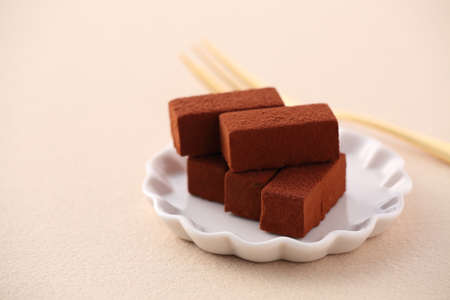 Raw chocolate on beige tableclothの写真素材