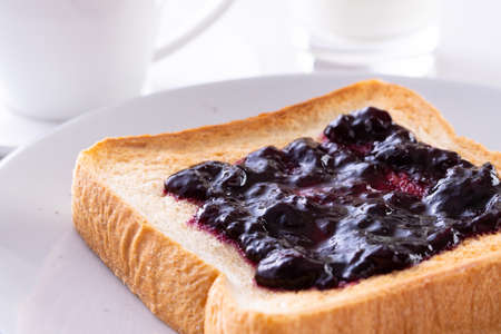 Toast and coffee with blueberry jamの写真素材