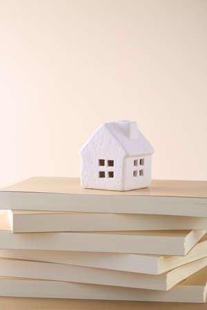 put a model of a house on top of a bookの写真素材