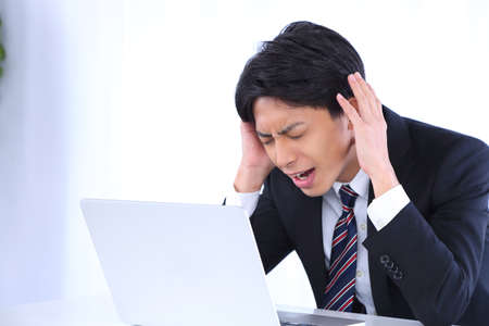 Businessmen suffer fromの写真素材