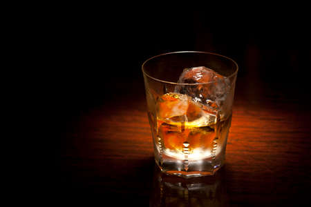 drink whiskey at the counter of the barの写真素材