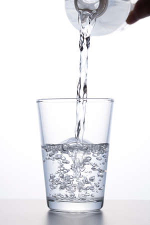 pour water into a glass