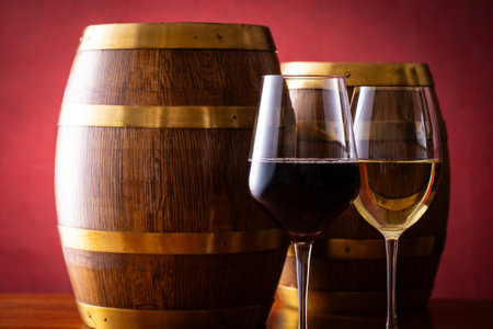 Two glasses of wine and a barrelの写真素材