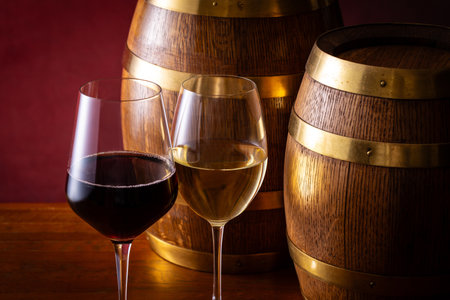 Two glasses of wine and a barrelの写真素材