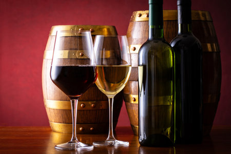 Two glasses of wine and a barrelの写真素材