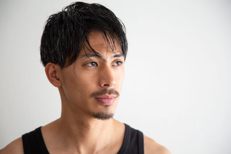 Portrait of a handsome Asian man in a black tank top.の写真素材