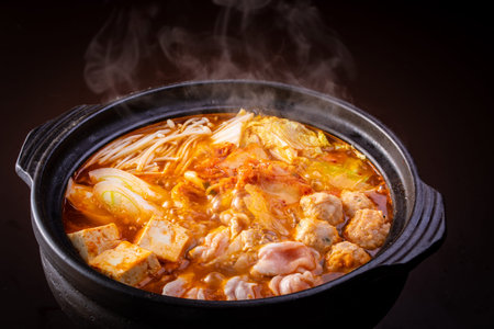 Kimchi soup with chicken and vegetables in potの写真素材