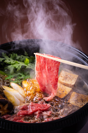 japanese hot pot with beef and vegetables on a dark backgroundの写真素材