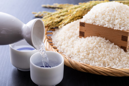 Japanese rice in a wicker basket and rice in a bowl.の写真素材
