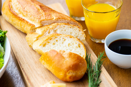 Breakfast with coffee, orange juice on wooden table