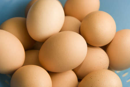Fresh brown eggs in basketの写真素材