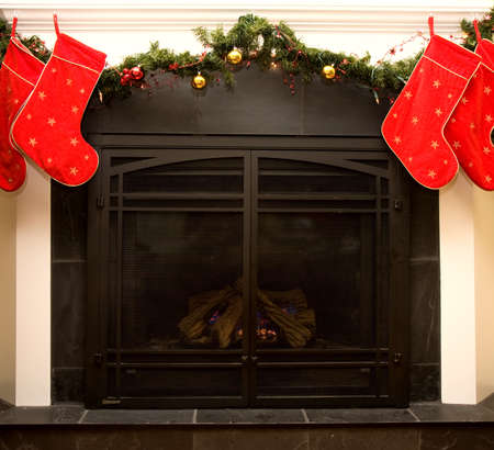 Christmas fireplace with decorated mantleの写真素材
