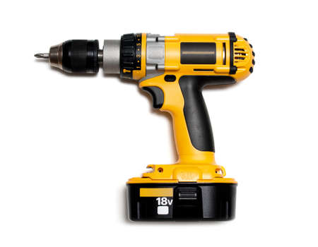Yellow cordless drill on white backgroundの写真素材