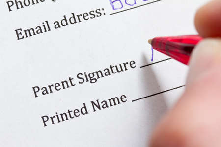 Signing parental consent form