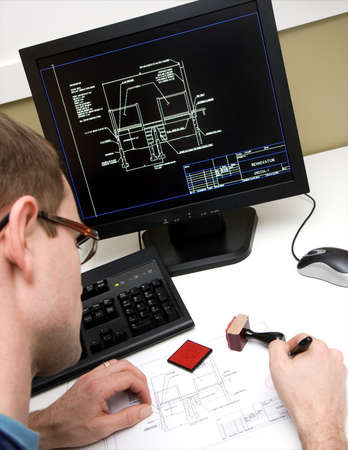 Engineer signing drawing