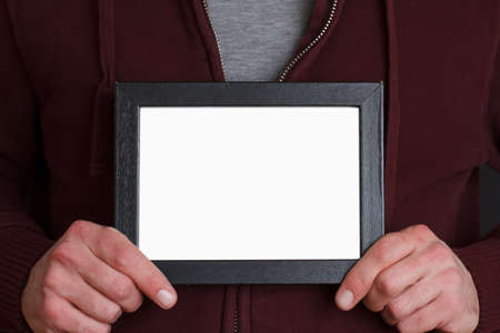 Casual person holding photoの写真素材