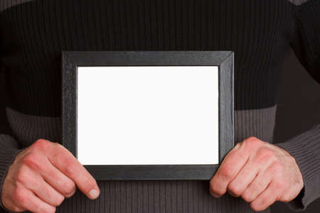 Casual man with photoの写真素材