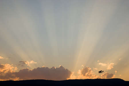 Flying off into sunsetの写真素材