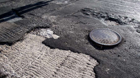 Road in need of repairの写真素材