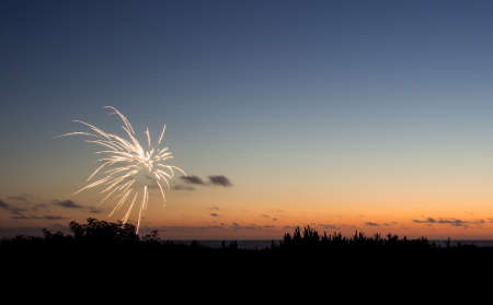 Fireworks at sunsetの写真素材