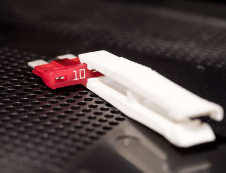 Removing fuse with toolの写真素材