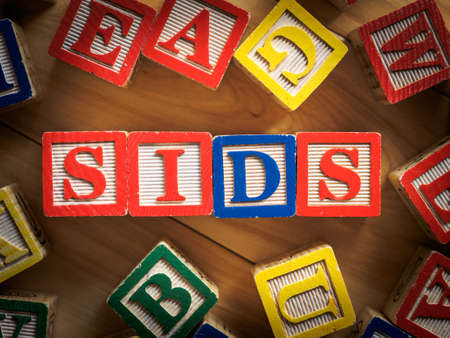 SIDS - Sudden infant death syndrome on wooden blocksの写真素材