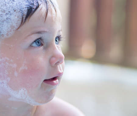 Cute boy in bubble bathの写真素材