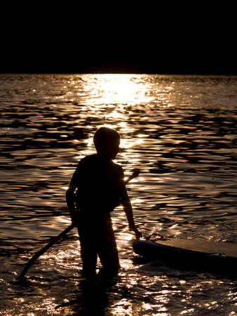 Boy paddle boardingの写真素材