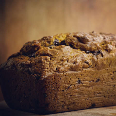 Pumpkin loaf on wood backgroundの写真素材