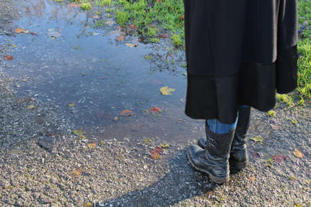 Inglese Girls Feet next To Water Puddleの写真素材