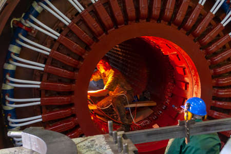 E.ON, Surgutskaya GRES-2, Surgut, Russia, 25.07.2012. Workers repair equipment at a thermal power...