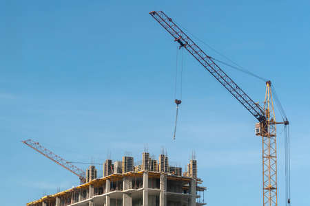 The upper part of the house under construction and a crane.