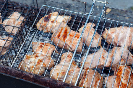 Barbecue is fried on the grill. Close-up.の写真素材