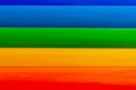 Background of rolls of colored vinyl filmの写真素材