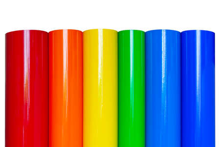Rolls of colored vinyl film isolated on white background.