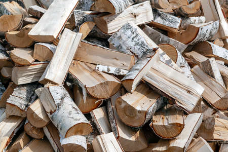Heap of birch firewood. Background.の写真素材