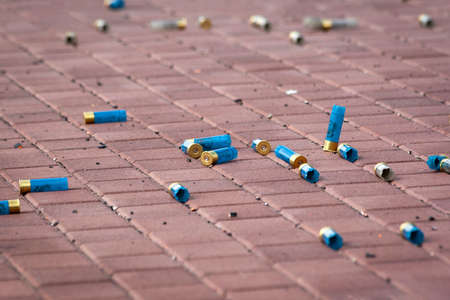 Surgut, Russia, 06/04/2016.Amateur competitions in shooting on flying clay targets. Hunting cartridges are scattered as a background.のeditorial素材